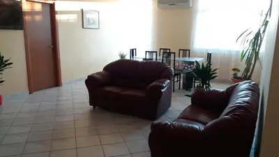 a living room with a couch and a table at Casa Timpanella in Partinico