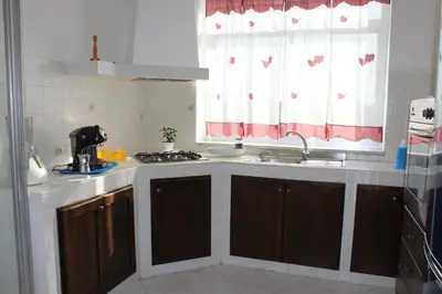 a kitchen with a sink and a window at Casa Timpanella in Partinico