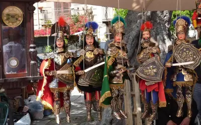 a group of people dressed in armor standing next to a tree at Casa Principe Maqueda in Palermo