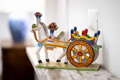 a figurine of a horse pulling a cart at Quattro Incanti in Palermo