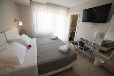 a hotel room with a bed with towels on it at B&B Attico 33 in Palermo