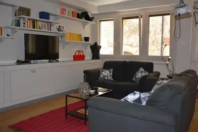 a living room with a couch and a tv at Luci della città Palazzo San Matteo in Palermo