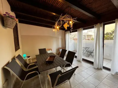 a dining room with a table and chairs at Sicilia Vacation in San Vito lo Capo