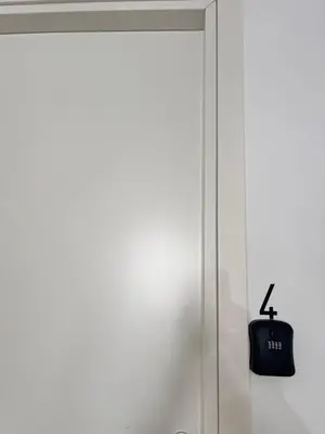 a door with a clock hanging on the wall at Sicilia Vacation in San Vito lo Capo
