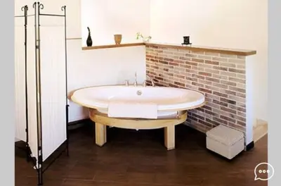 a white bathroom with a toilet and a sink at Case Vacanza Cipriano spacious apartment and cosy studio monolocale in Torretta