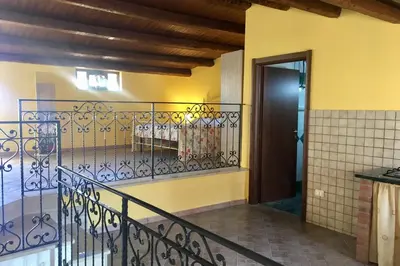 a balcony with a wrought iron railing next to a door at Al Duomo in Partinico