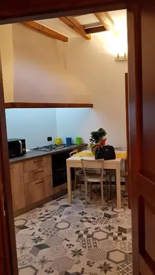 a kitchen with a table and a table and a table and a tableablish at b&b Caravella in Mezzojuso