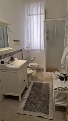 a bathroom with a toilet and a sink and a shower at Duchi in Palermo