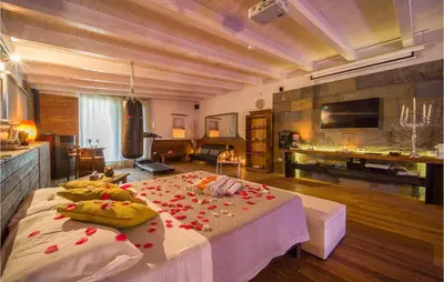 a large room with a bed with flowers on it at Palermo Per Due in Torretta