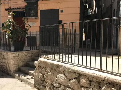 a wrought iron fence in front of a building at Appartamento san Domenico in Palermo