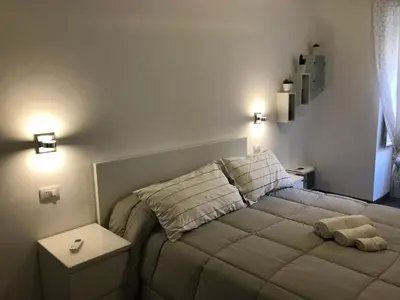 a bedroom with a bed with two pillows at Appartamento san Domenico in Palermo