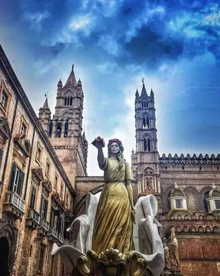 a statue of a woman standing in front of a building at Matilde Boutique Hotel by AR Group Hotels in Isola delle Femmine