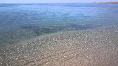 a beach with clear water at Villa Margherita in Terrasini