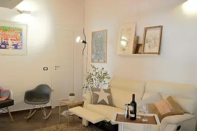 a living room with a couch and a table at Uloft Apartment Palermo in Palermo