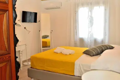 a bedroom with a bed with two towels on it at B&B Nencioli in Castellammare del Golfo
