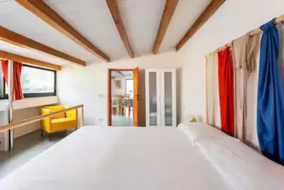 a bedroom with a large bed and a desk at Charming loft con Terrazze al Teatro Massimo in Palermo