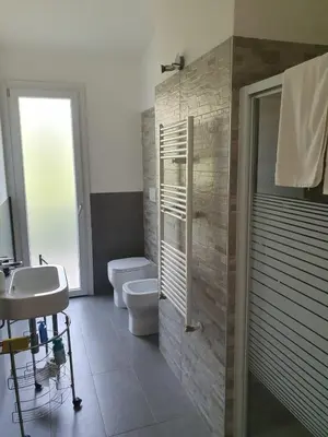 a bathroom with a sink and a toilet and a shower at Villa Limone in Castellammare del Golfo