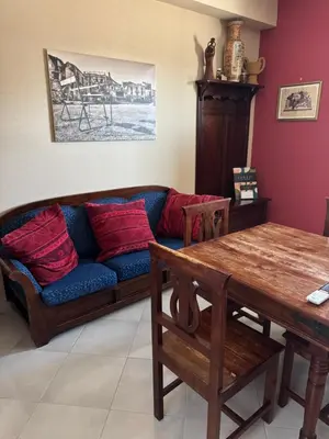 a living room with a couch and a table at Palace Bed & Breakfast in Salaparuta