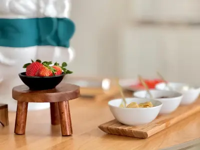 a table with bowls of strawberries and bowls of cereal at Villa di Nera B&B in Palermo