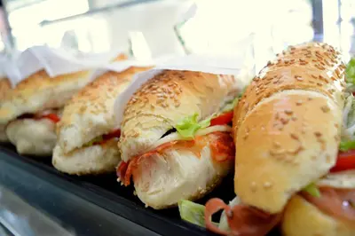 a group of sandwiches sitting on a shelf at Enny Camere in Alcamo