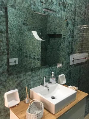 a bathroom with a sink and a glass shower at Casa Vacanze Astori in Trabia