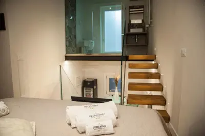 a room with towels on a bed with a staircase at Petrosino in Palermo