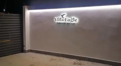 a wall with a sign on the side of a building at Villa Eagle in Terrasini