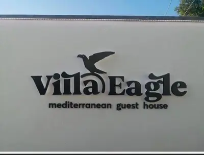 a sign for a mediterranean guest house at Villa Eagle in Terrasini