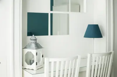 a room with two white cribs and a lamp at Dietro il Teatro in Palermo