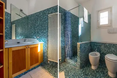 two pictures of a bathroom with a toilet and a sink at Terrazze di San Francesco by Wonderful Italy in Palermo