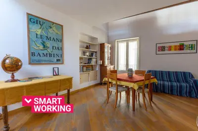 a living room with a table and a couch at Terrazze di San Francesco by Wonderful Italy in Palermo