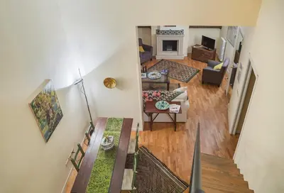 an overhead view of a living room and dining room at Kalsa Casa di Charme con terrazza by Wonderful Italy in Palermo