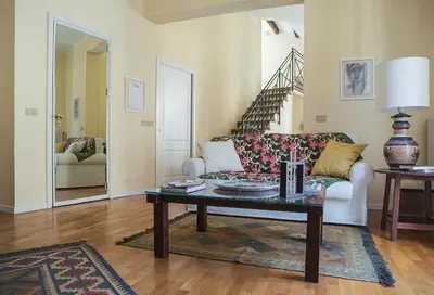 a living room with a couch and a coffee table at Kalsa Casa di Charme con terrazza by Wonderful Italy in Palermo