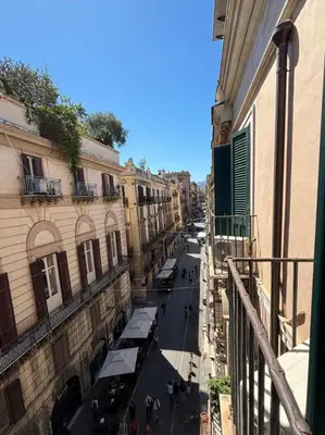 a view of a city street from a balcony at Casa di Cocò in Palermo