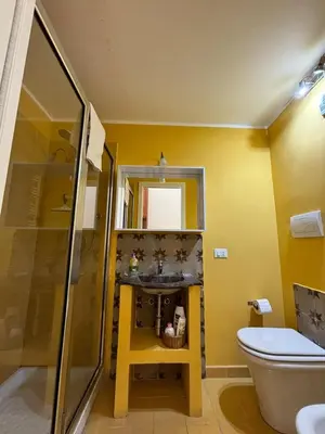 a living room with a couch and a table at Casa di Cocò in Palermo
