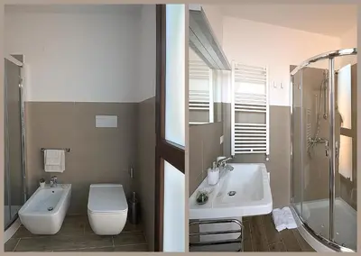 a bathroom with a toilet and a sink and a shower at Alla Corte Maqueda in Palermo