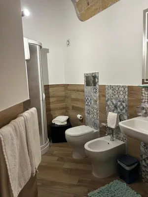 a bathroom with a toilet and a sink at B&B Cinisi Vacanze 2.0 in Cinisi