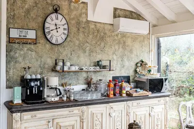 a dining room table with a wooden top and chairs at Grotta dei Puntali B&B in Carini