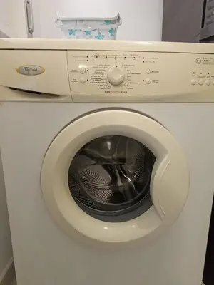 a white washing machine with its door open at Villa Pinella in Palermo