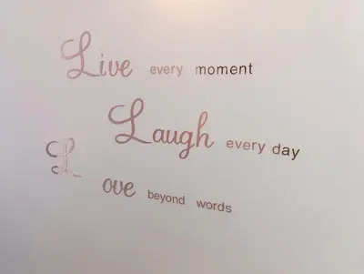 a sign that says live every momentlaugh every day we beyond words at Villa Pinella in Palermo