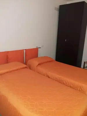 two beds sitting next to each other in a room at Appartamento Nino in San Vito lo Capo
