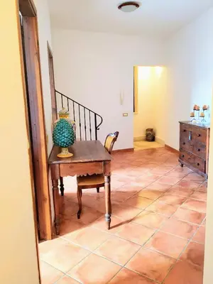 a room with a table with a vase on it at Summer Dream LA CASA SUL MARE in Trappeto