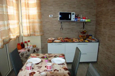 a room with a table with plates of food on it at B&B Palermo Sole & Cultura in Palermo