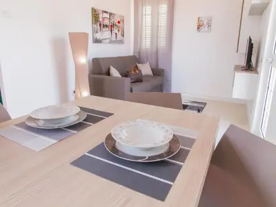 two plates on a table in a living room at Gelso Bianco Apartments in Campofelice di Roccella