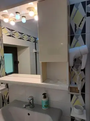 a bathroom with a sink and a mirror at Kairos B&B in San Giuseppe Jato