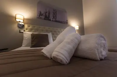 a hotel room with towels on a bed at Casantò guest home in Palermo