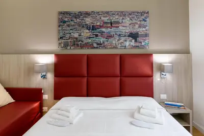 a bathroom with a shower with a mosaic wall at Belmonte102 Esclusive Suites in Palermo