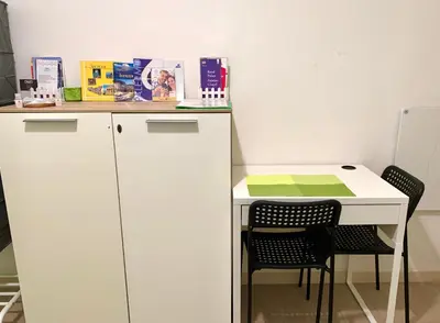 a small white desk with two chairs and a table at Bruno and Breakfast in Palermo