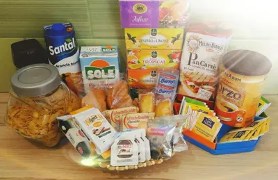 a basket filled with food and other food items on a table at Bruno and Breakfast in Palermo
