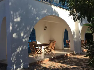 a patio with a table and chairs in a building at villa Anna Silvia Makari fiction rai 1 Casa Saverio La Manna in San Vito lo Capo